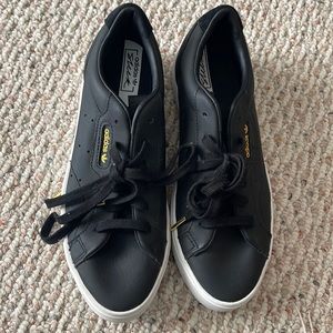 Black adidas sneakers with gold accents worn once